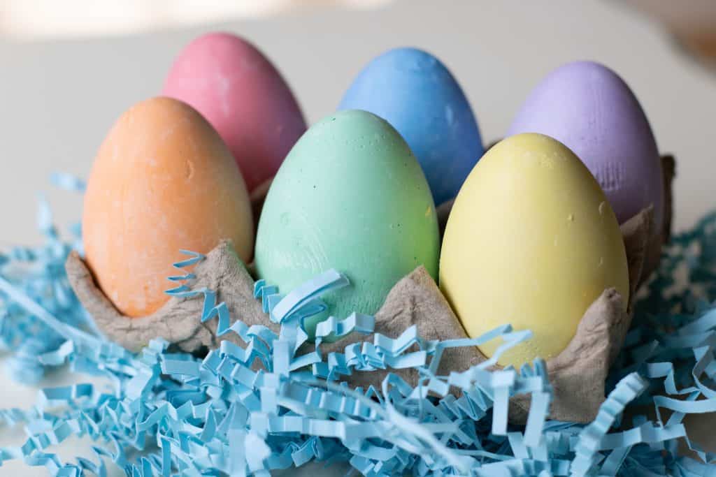 6 chalk eggs in a carton.