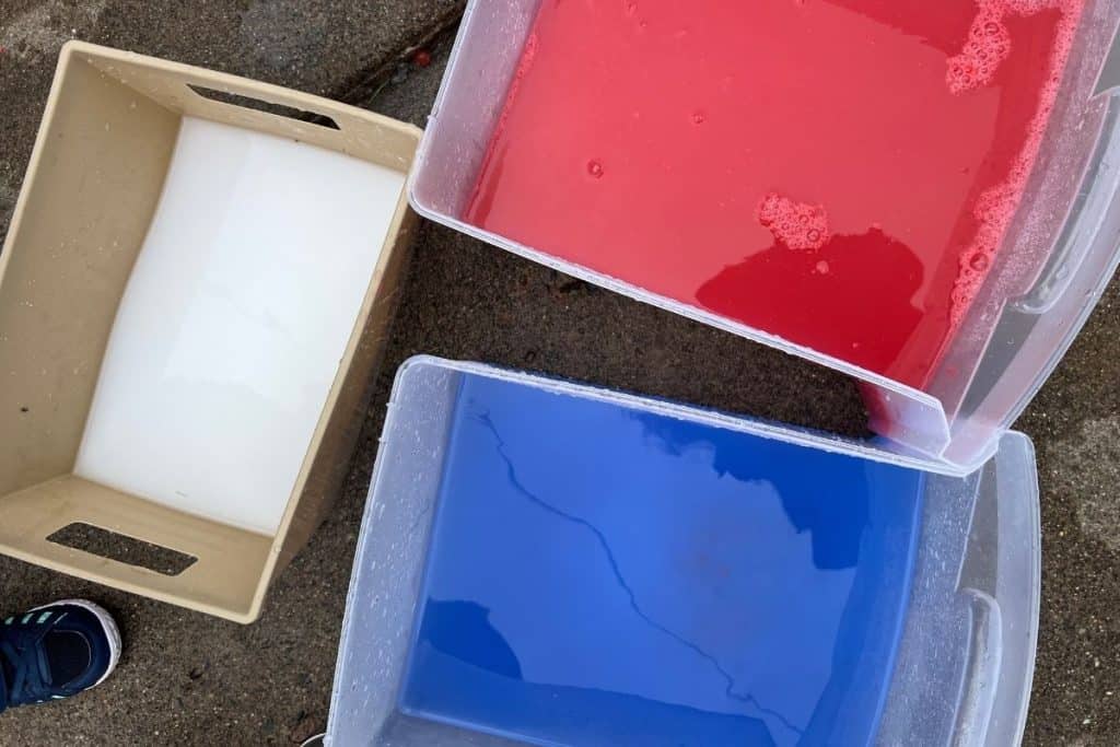 Patriotic buckets of colored water.