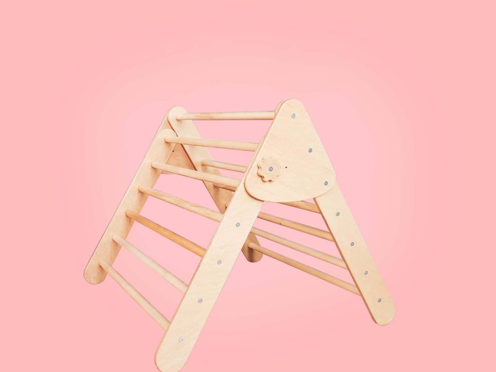 two Montessori wooden climbing triangles. One taller and one shorter