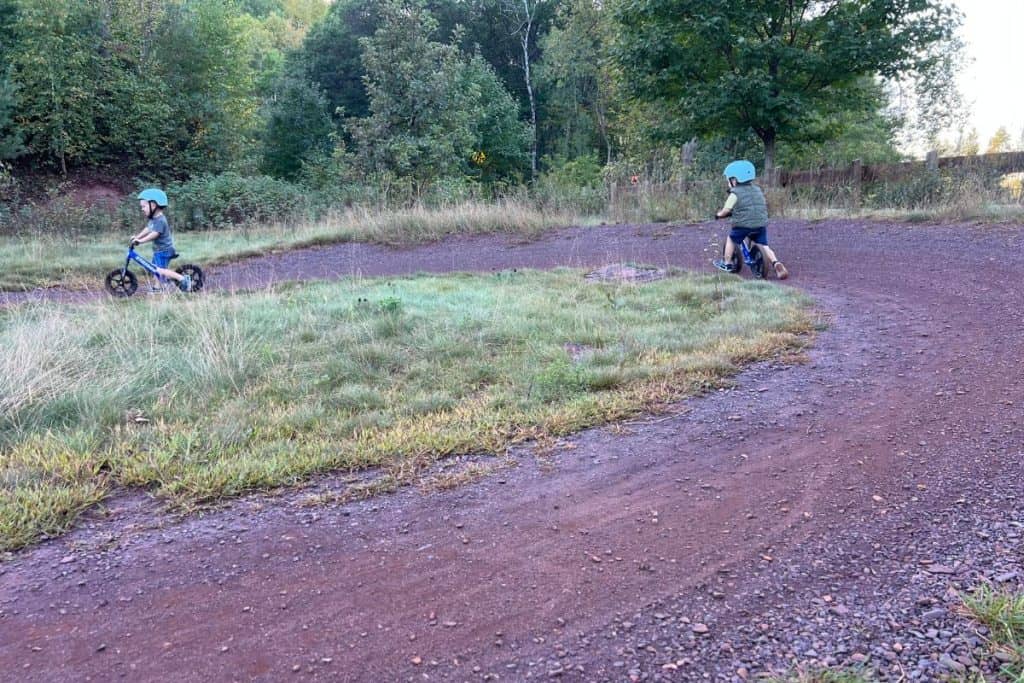 Two kids biking.