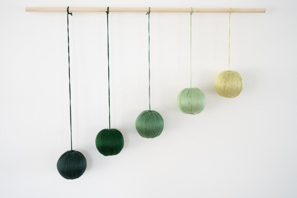 Complete Gobbi baby mobile with balls hung at a 45-degree angle.