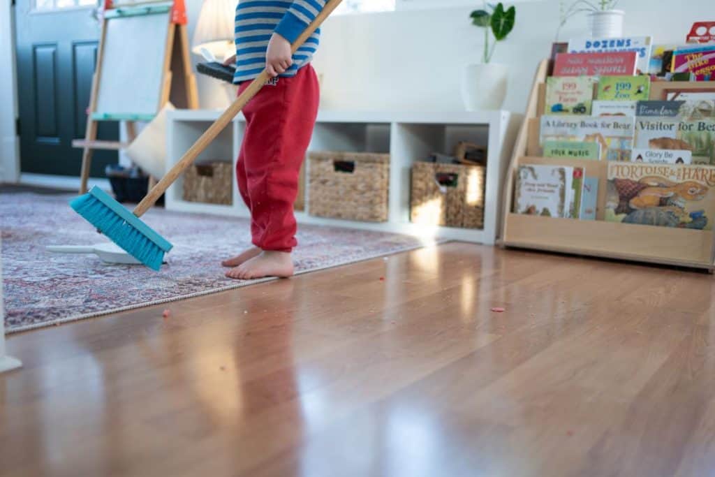 Child sweeping.