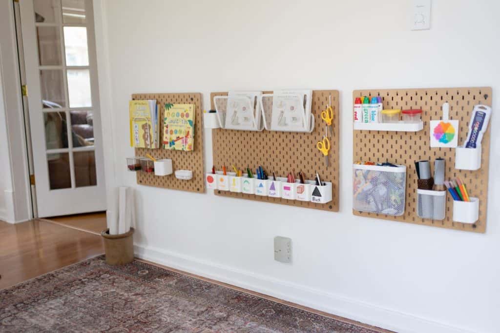 Wall peg boards with supplies hung up.