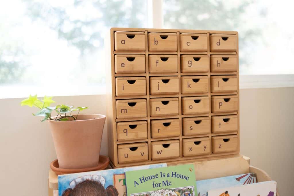 Montessori phonetic cabinet with alphabet drawers.