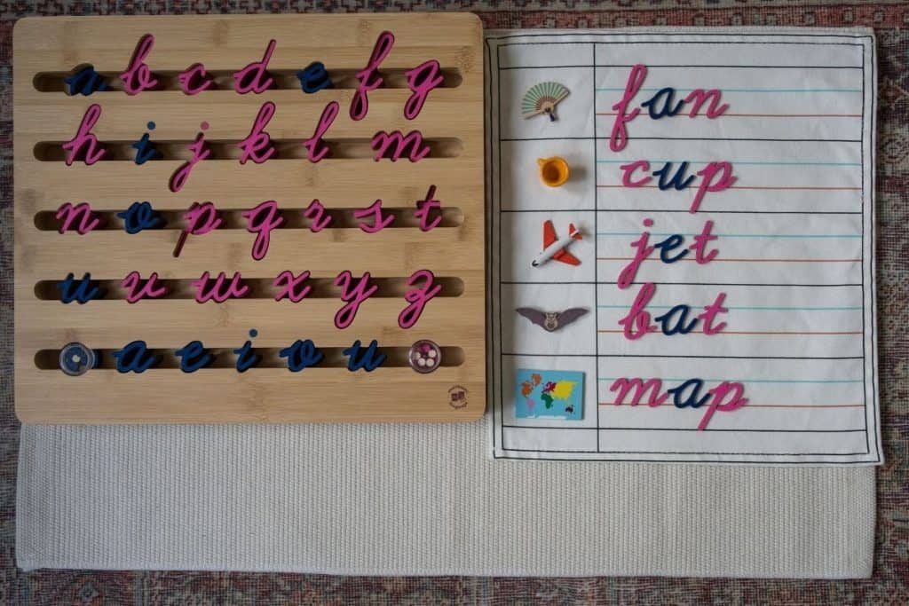 Montessori movable alphabet and words written out with small objects.